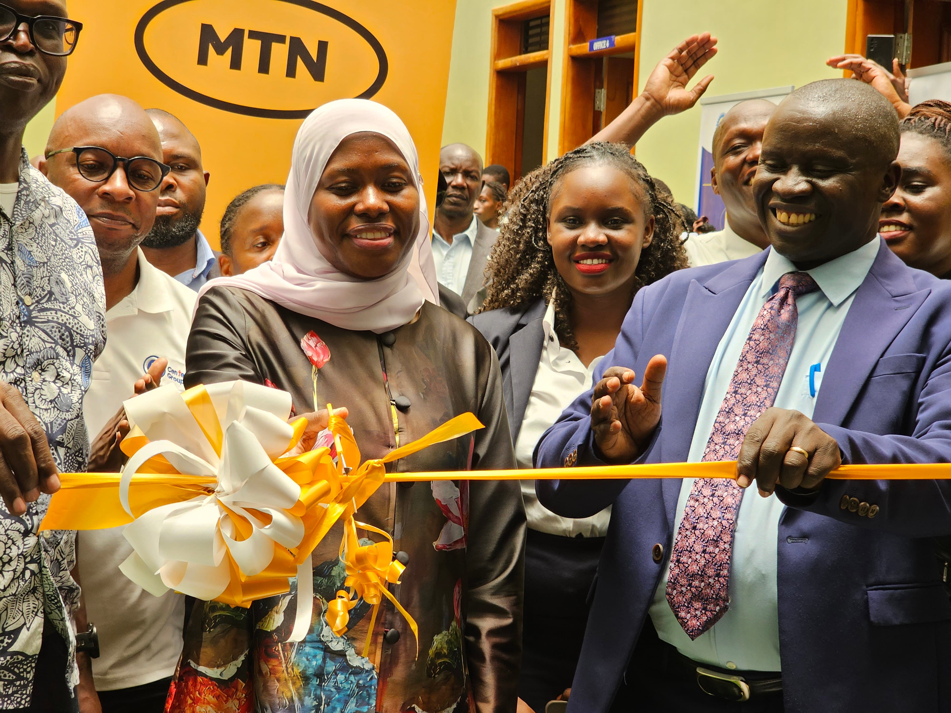 Dr Amina Zawedde, Permanent Secretary at the Ministry of ICT and National Guidance, cuts the ceremonial ribbon alongside Busitema University leaders and partners to officially launch the MTN Spark Hub at Busitema Campus on 15 September 2026.