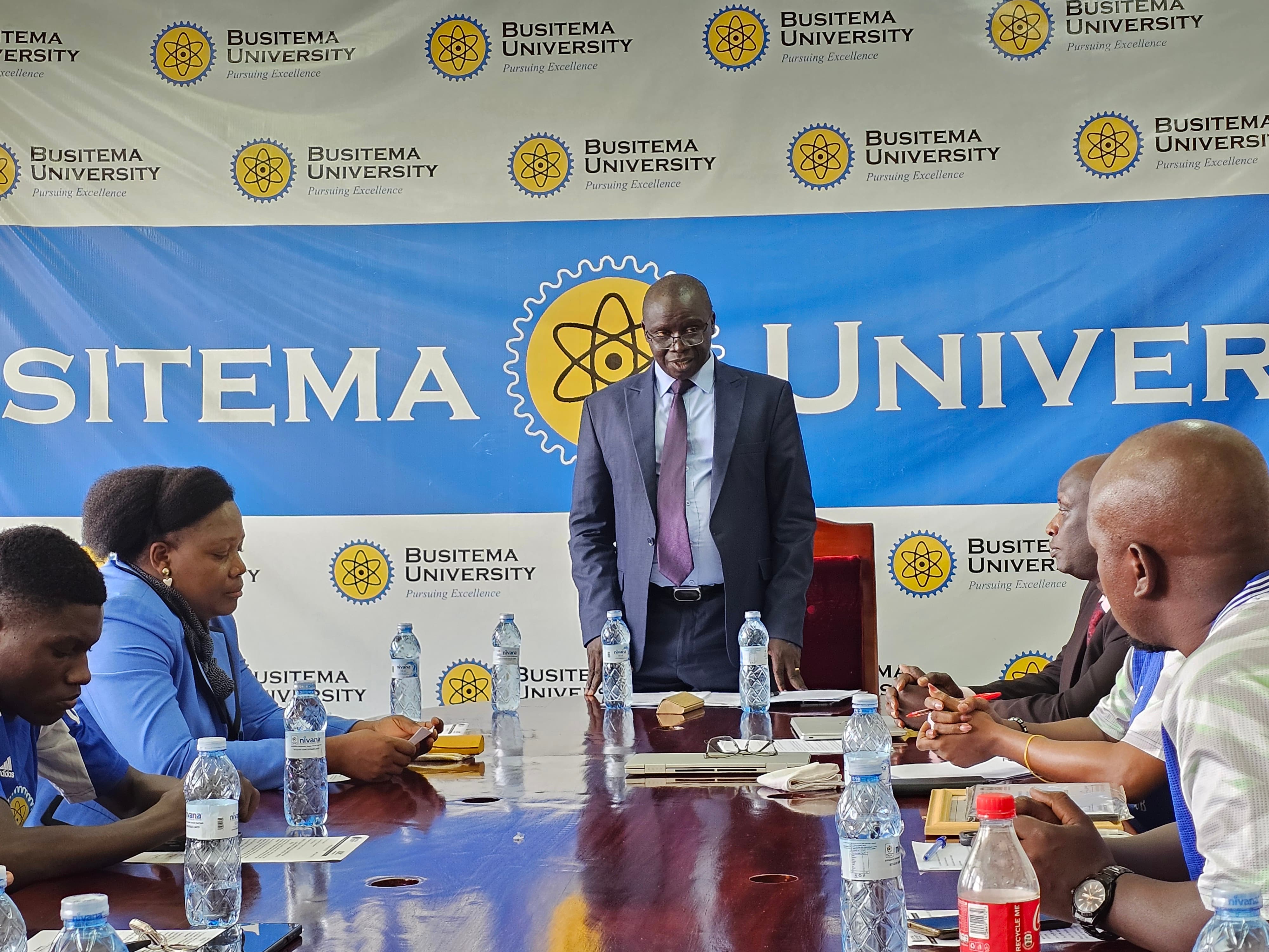 Members of the Busitema University Corporate Team listen as Vice Chancellor Prof. Paul Waako outlines the University's expectations ahead of the Kabale tournament, during the flag-off ceremony held on 21 October 2026 at the Vice Chancellor's Boardroom, Busitema Campus.