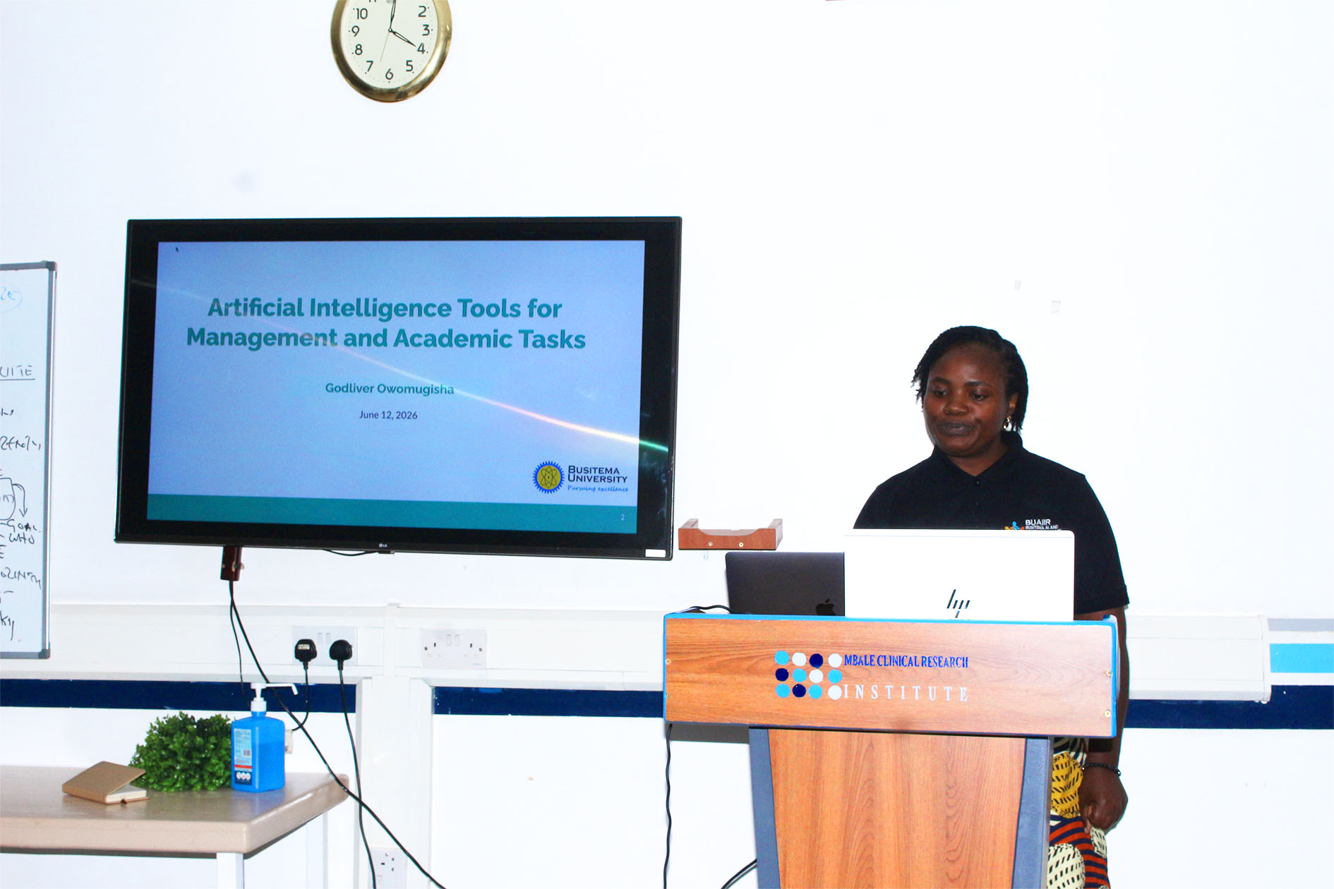 Dr. Godliver Owomugisha takes participants through a session on AI tools for management and academic tasks