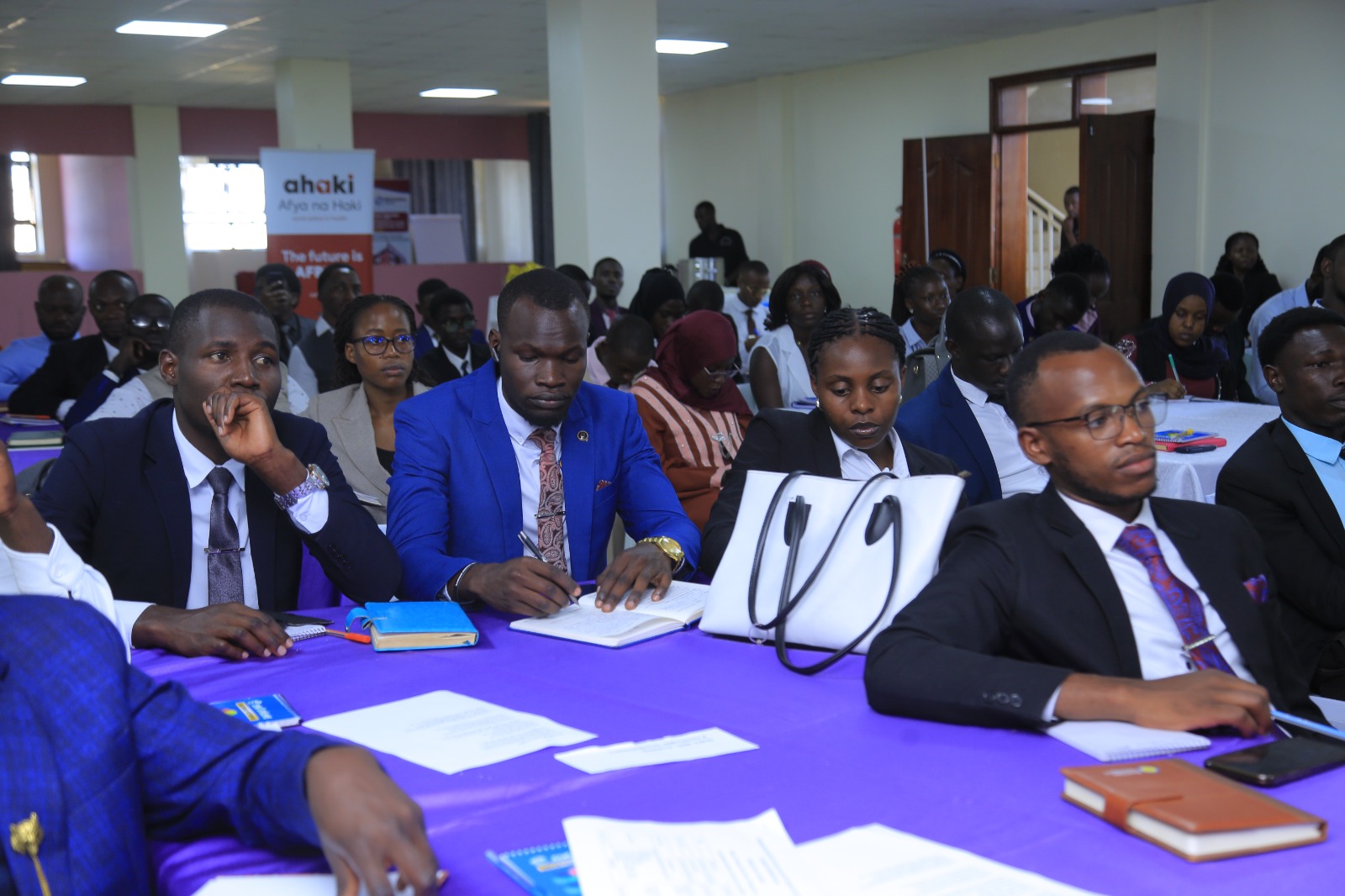 Busitema University Guild President Kamara Onesmus, pictured on the extreme right, follows proceedings alongside other members of the University delegation during the 10th Annual Deans of Students and 18th Guild Leaders’ Conference at Bishop Stuart University in Mbarara.