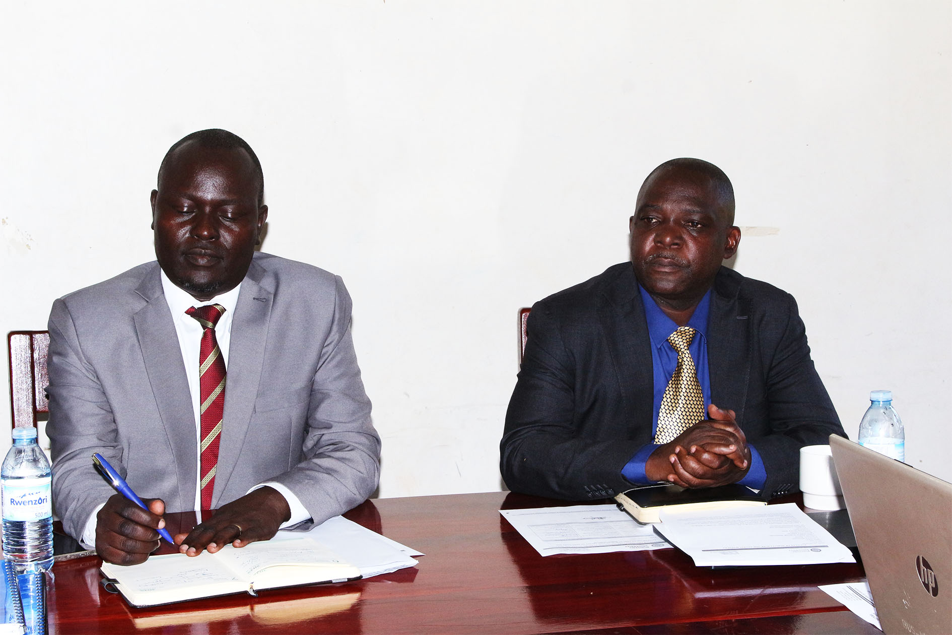 L–R: Outgoing Dean Prof. Egonyu James Peter and incoming Dean Dr. Geoffrey Lubadde during the handover ceremony