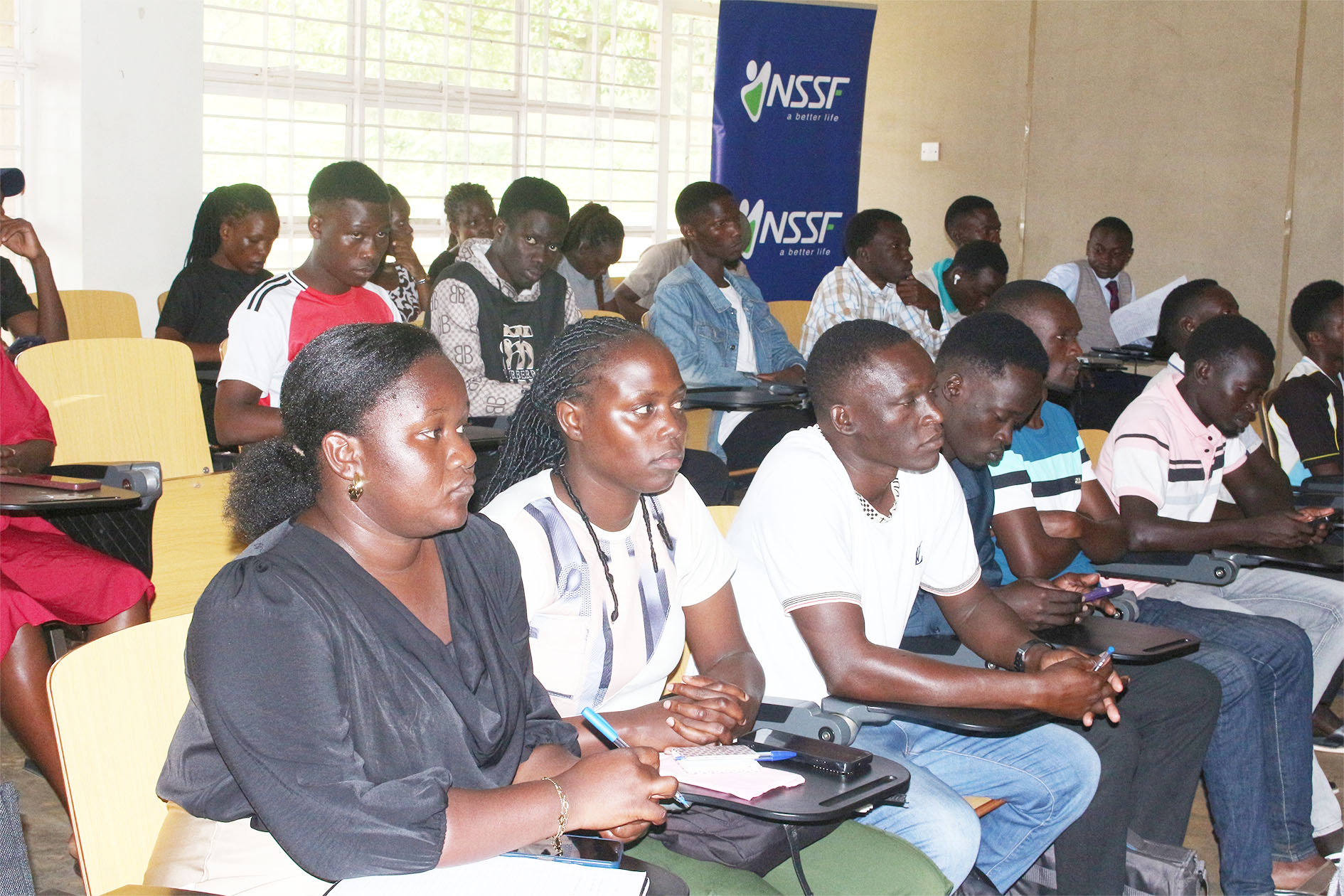 Students listen attentively during one of the presentations at the AI Expo