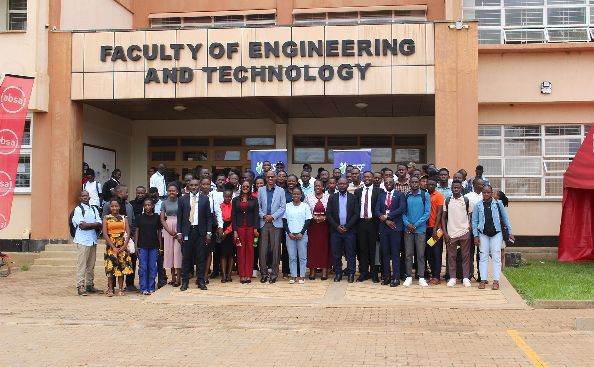 Representatives from Absa Bank, NSSF, and AI Studio Uganda join staff and students of the Faculty of Engineering and Technology for a group photo during the Expo