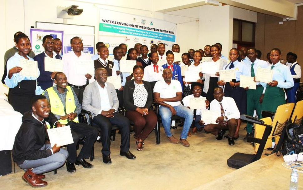Participants in the youth debate join representatives from the Ministry of Water & Environment and Youth Go Green for a group photo at the close of the event