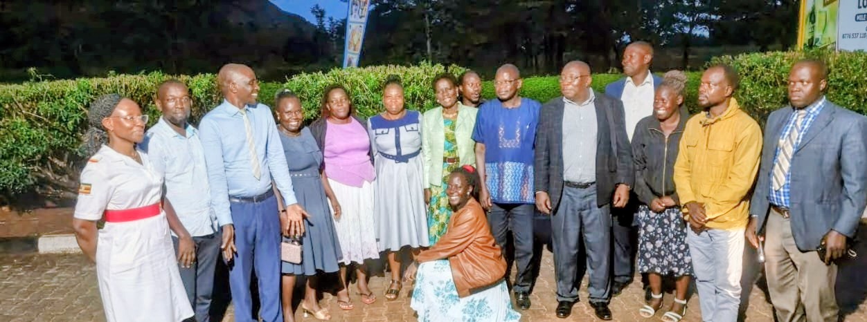 Mrs. Sophia Acon poses for a group photograph with staff of the Dean of Students' Department 