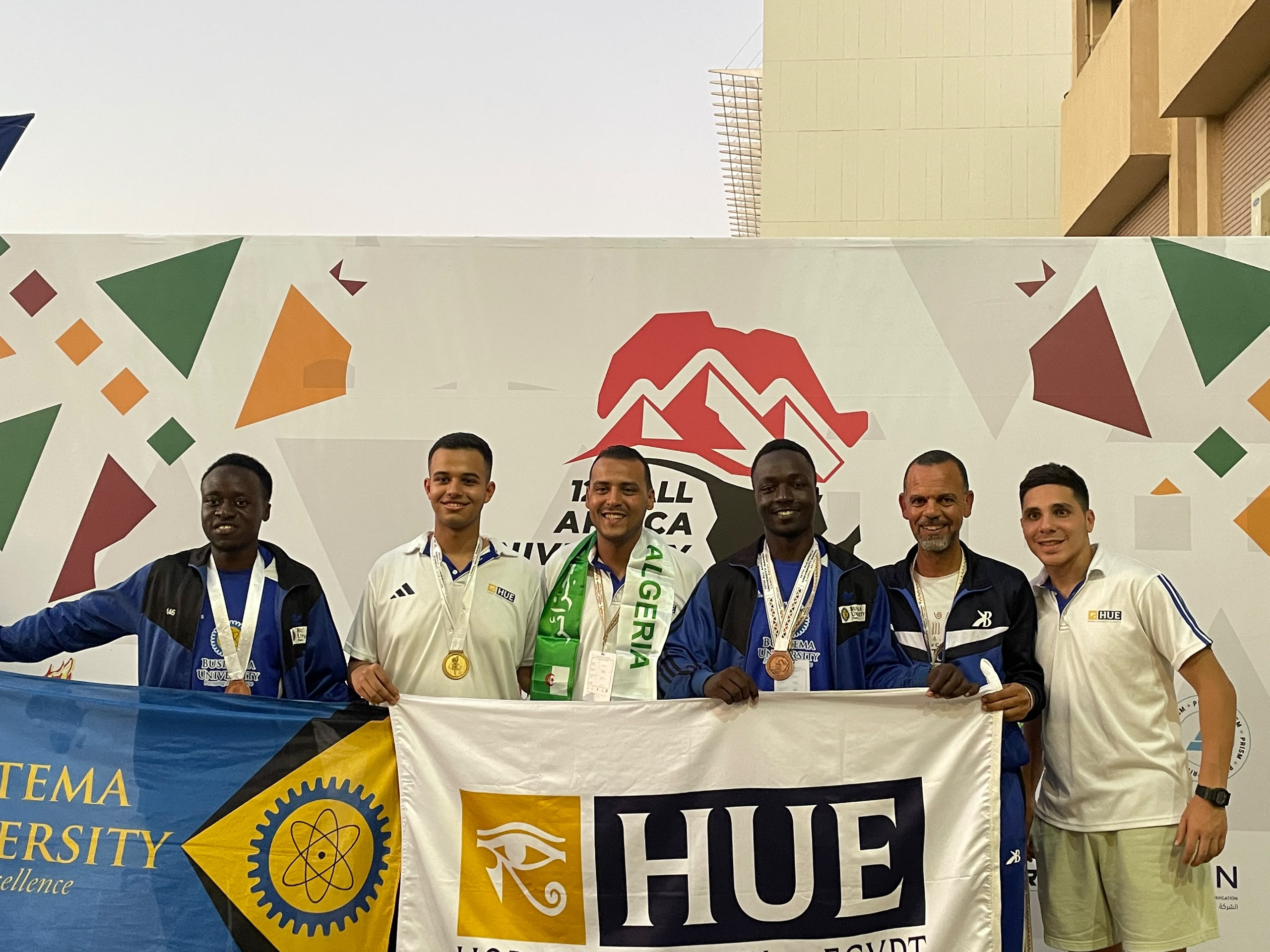 Busitema University’s men’s chess team poses with the gold and silver medal-winning teams from Horus University Egypt and an Algerian university, respectively, at the Chess Blitz Tournament during the 12th All-Africa University Games, Cairo 2026