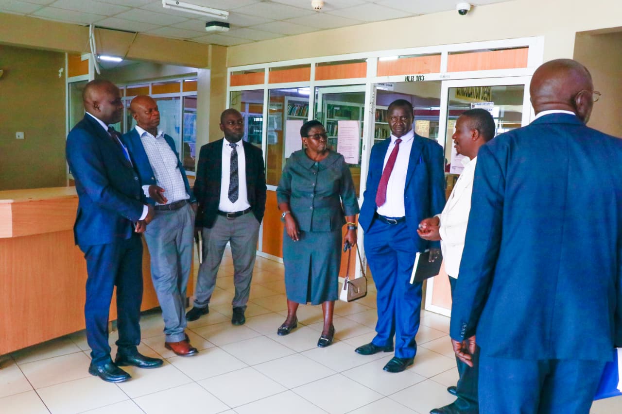 Busitema University officials interact with their Kibabii University counterparts during a tour of academic and research facilities